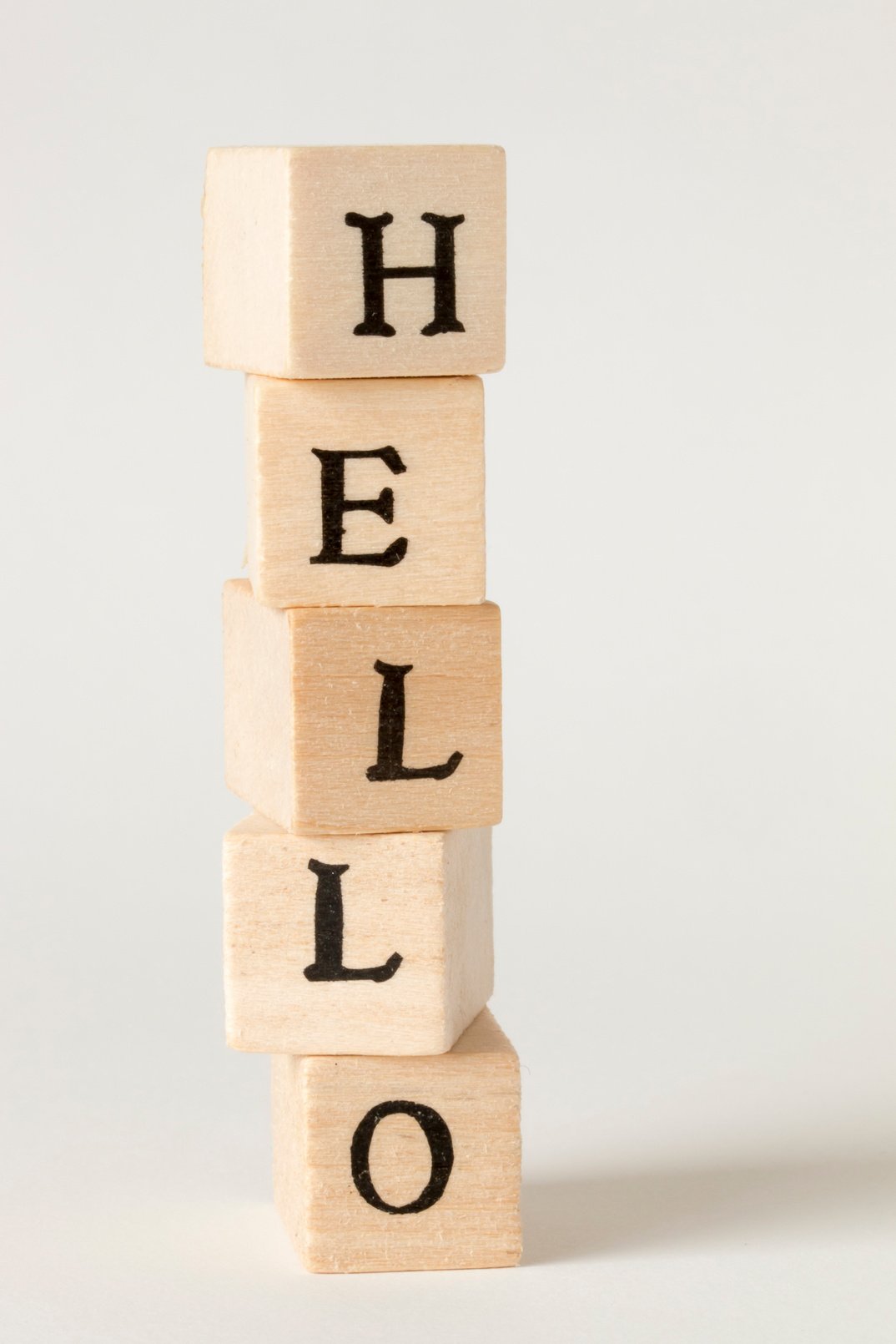 HELLO.wooden cube written as HELLO.